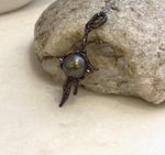 Black Tahitian ocean pearl pendant with organic lava inspired copper design