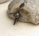 Artistic molten lava pendant with genuine Tahitian black pearl and copper setting