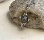 Genuine saltwater Tahitian hunter pearl pendant with unique flowing molten lava design