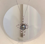 Tahitian platinum pearl eye necklace featuring a genuine ocean pearl and artistic copper setting