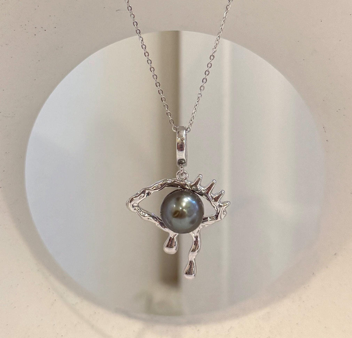 Halloween eye pendant featuring a lustrous genuine Tahitian saltwater pearl