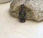 Peacock hunter Tahitian pearl jewelry with decorative copper lantern setting
