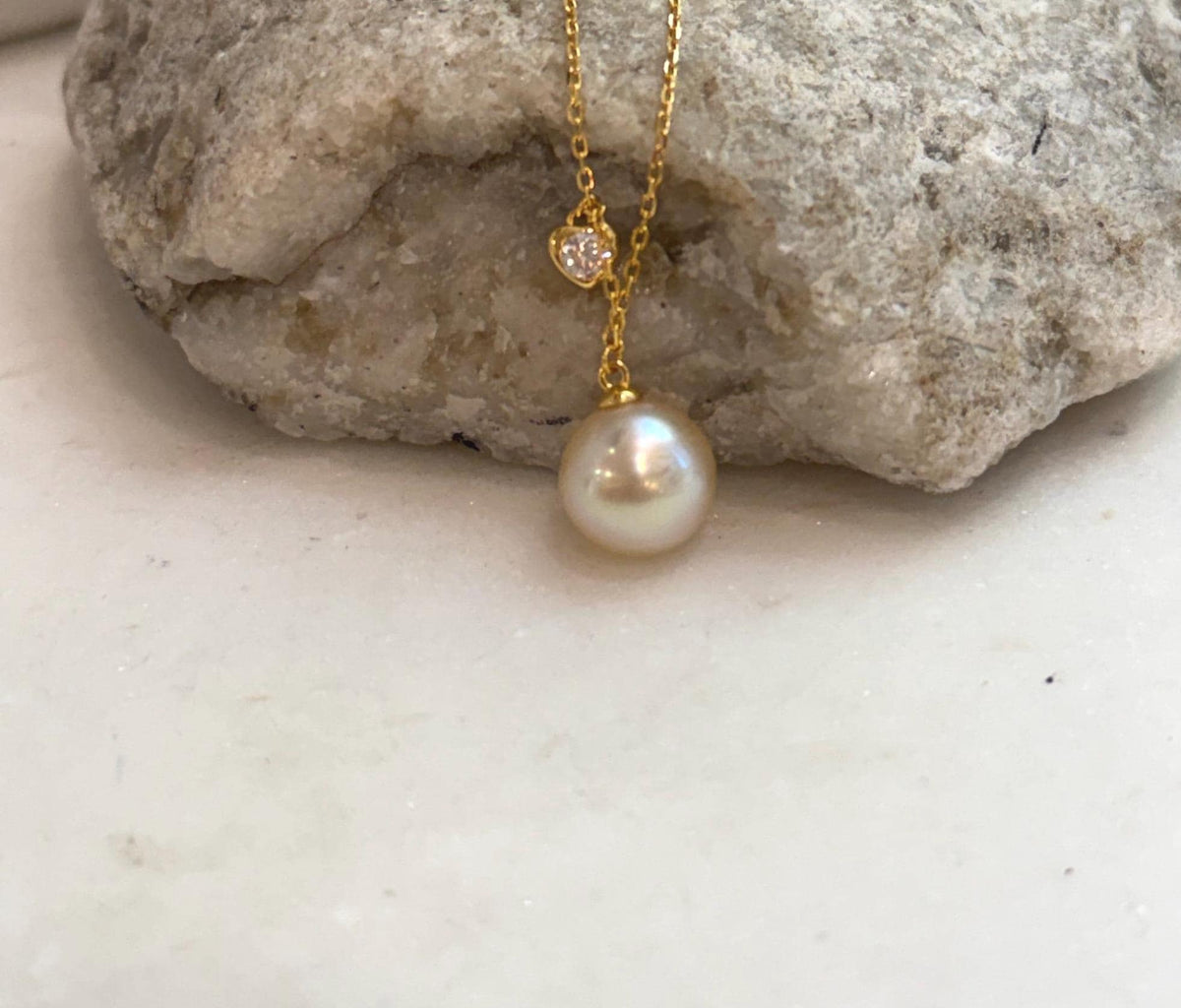 Genuine South Sea gold pearl pendant with luminous iridescent overtones and an elegant S925 sterling silver chain.