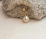 Fine South Sea saltwater pearl pendant with warm golden iridescent tones and an elegant sterling silver chain.