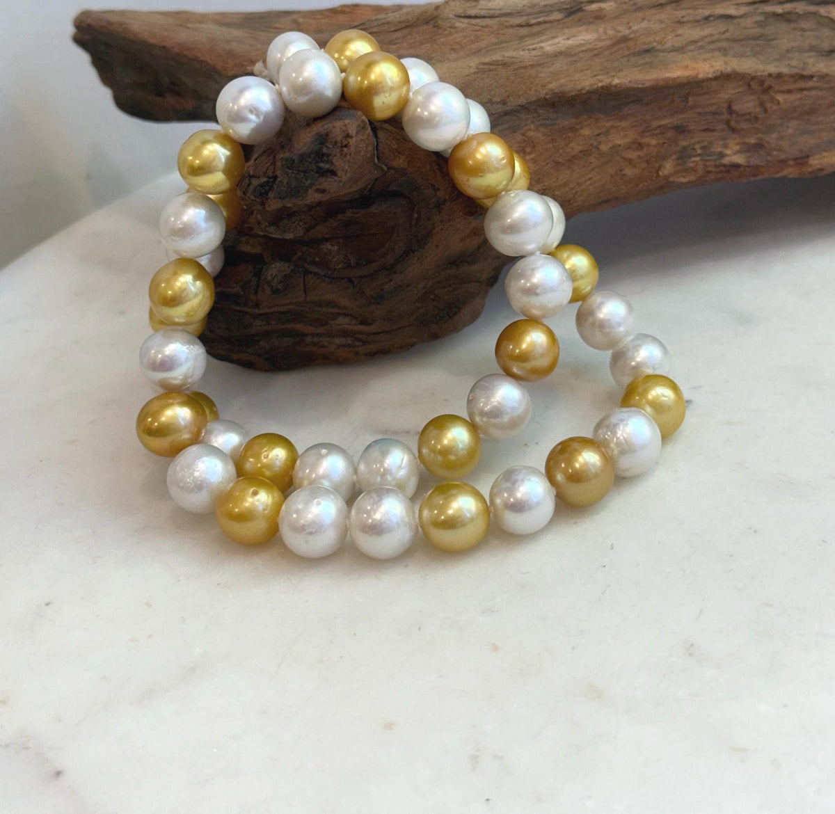 Edison pearl strand showing the contrast between creamy white and warm golden pearls.