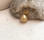 Genuine saltwater South Sea golden pearl pendant with rich deep tea gold color and brilliant luster.