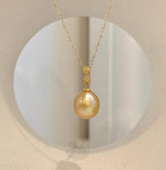 Luxury South Sea golden ocean pearl pendant with smooth surface and intense mirror-like shine.