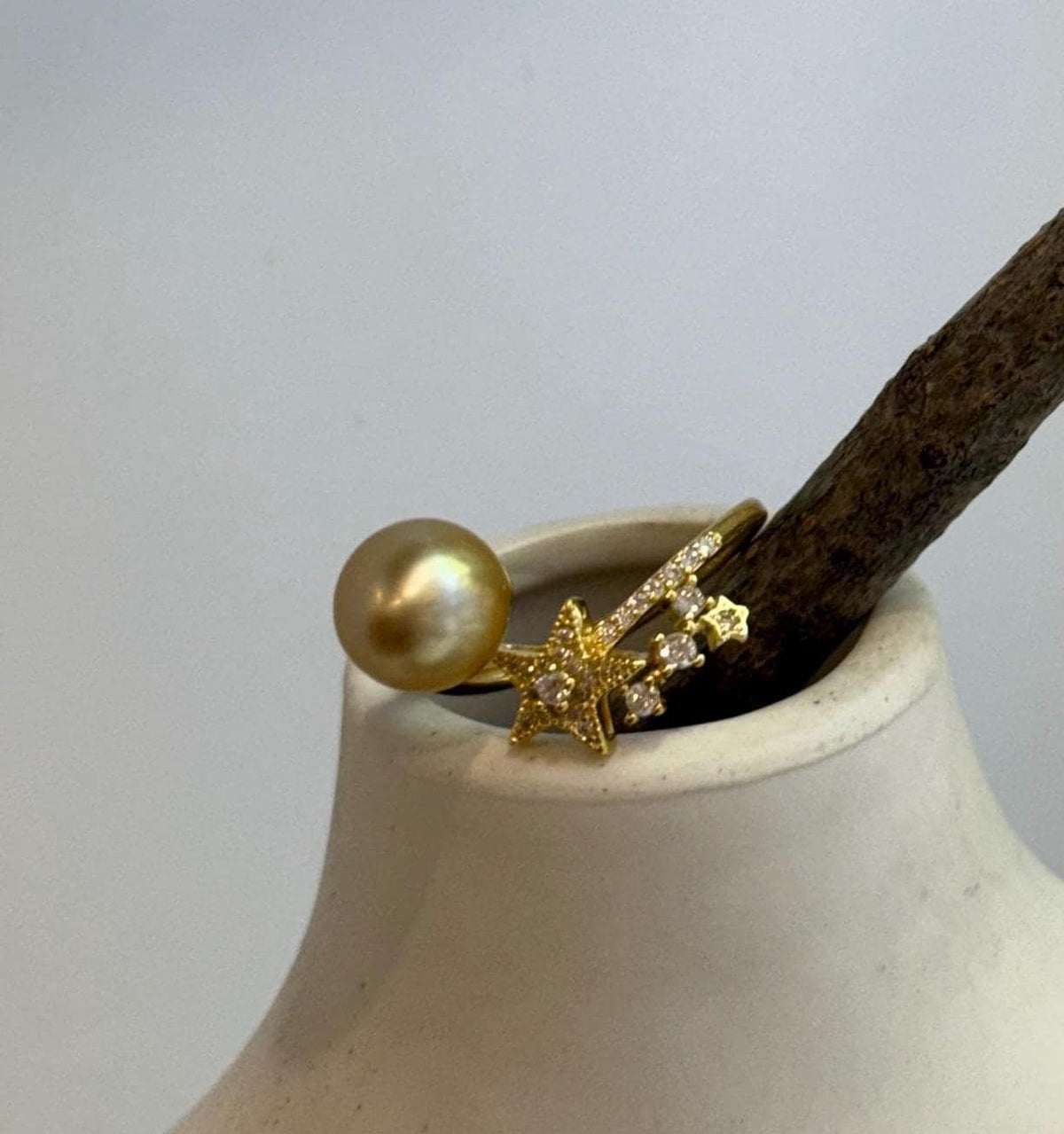 Vintage-style star ring featuring a golden South Sea pearl and an adjustable gold-plated sterling silver band.