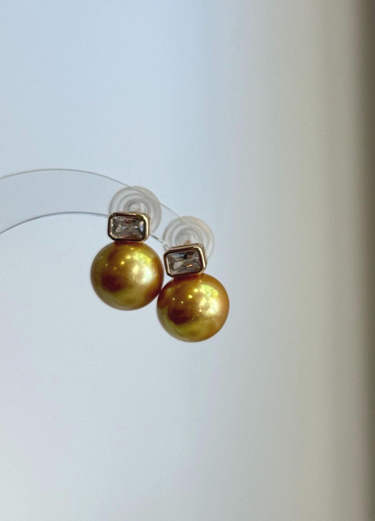 Front view of the deep tea golden pearl stud earrings.