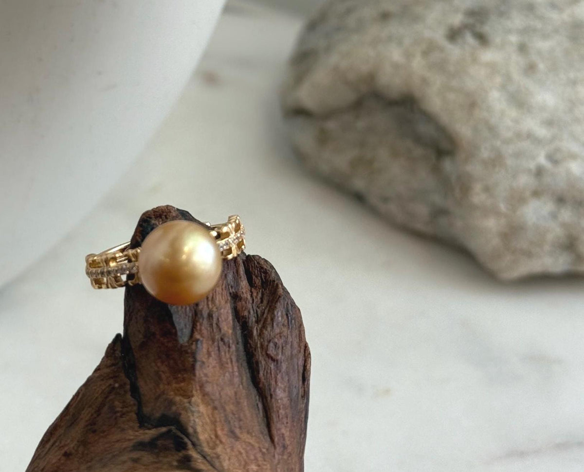 Genuine saltwater pearl at the center of an ornate sterling silver ring.