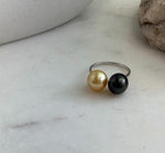 Golden South Sea pearl showing bright reflections on a minimalist silver ring.