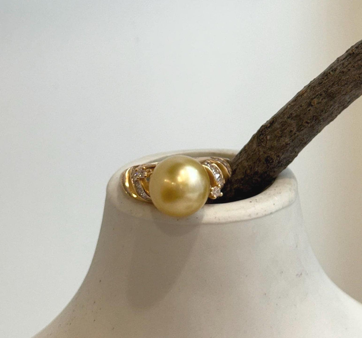 Deep tea gold saltwater pearl ring featuring a lustrous South Sea pearl and delicate adjustable setting