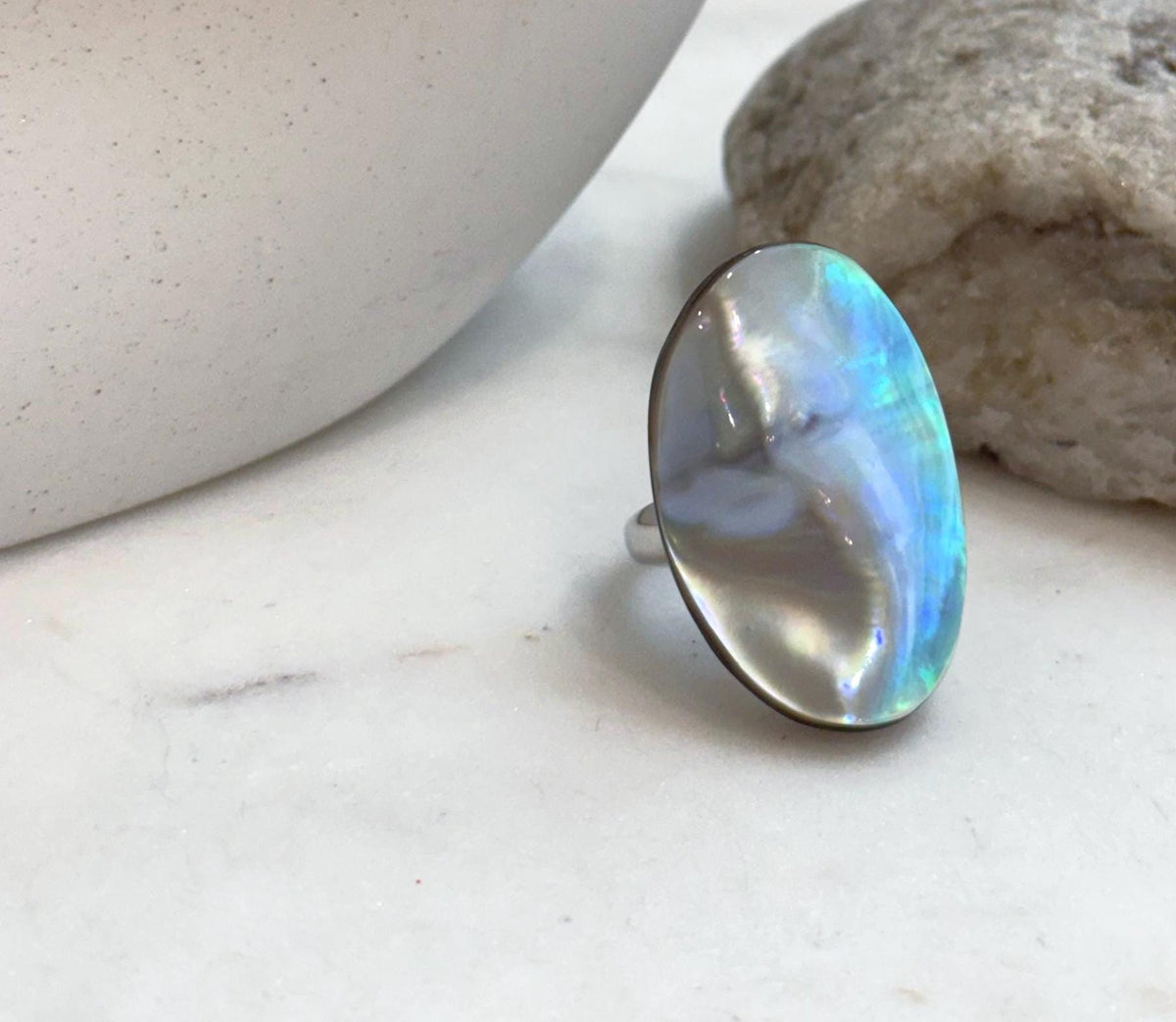 Rainbow iridescent Ocean Mabe pearl statement ring with vivid blue green overtones and extreme mirror luster