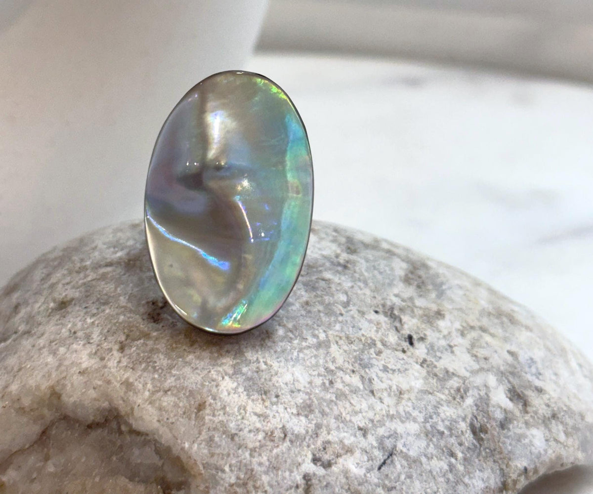 Genuine saltwater Ocean Mabe pearl ring featuring luminous rainbow colors and a bold organic shape