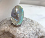 Genuine saltwater Ocean Mabe pearl ring featuring luminous rainbow colors and a bold organic shape