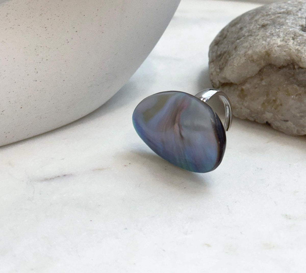 Ocean Mabe pearl statement ring showing intense rainbow iridescence and highly reflective natural luster