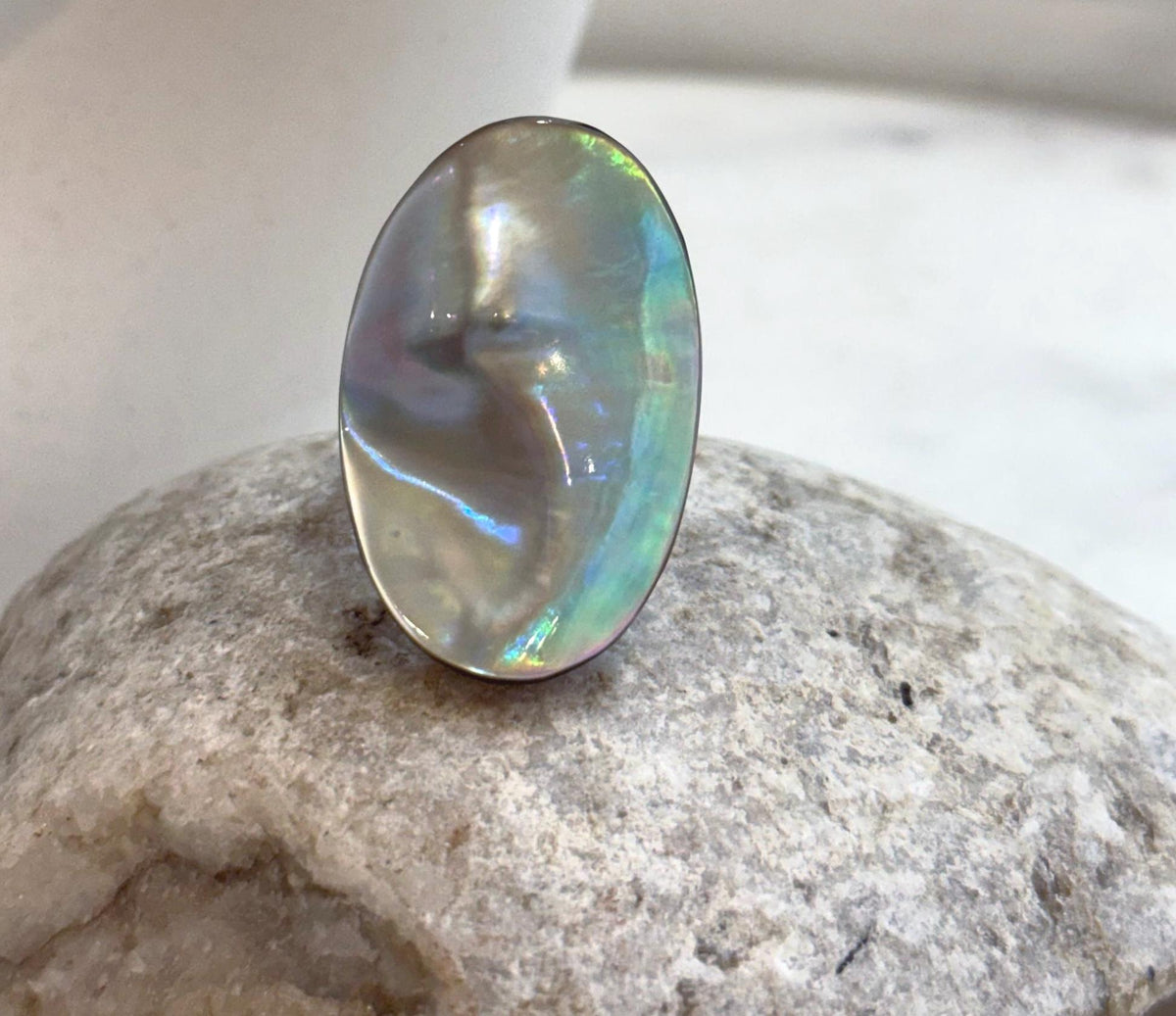 Genuine Mabe pearl ring with luminous silver blue green overtones and artistic statement design