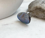 Large saltwater Mabe pearl ring with dramatic rainbow glow and adjustable sterling silver band