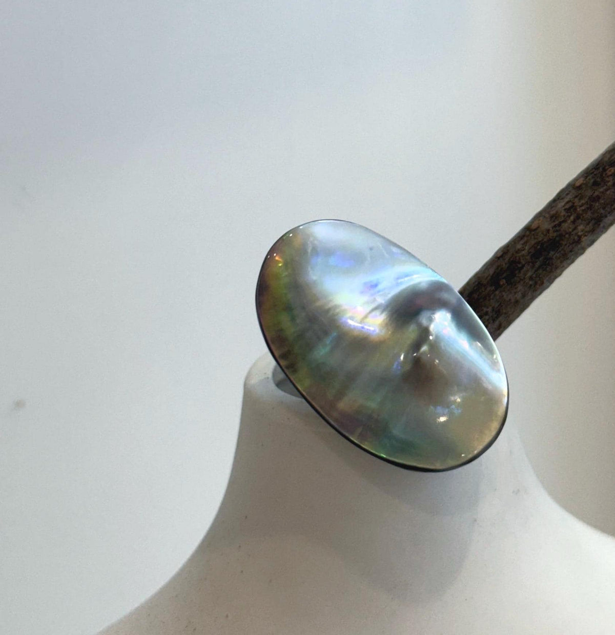 Genuine Ocean pearl ring featuring an organic oval Mabe pearl with strong rainbow iridescence
