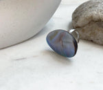 Adjustable sterling silver ring set with a luminous rainbow iridescent Ocean Mabe pearl