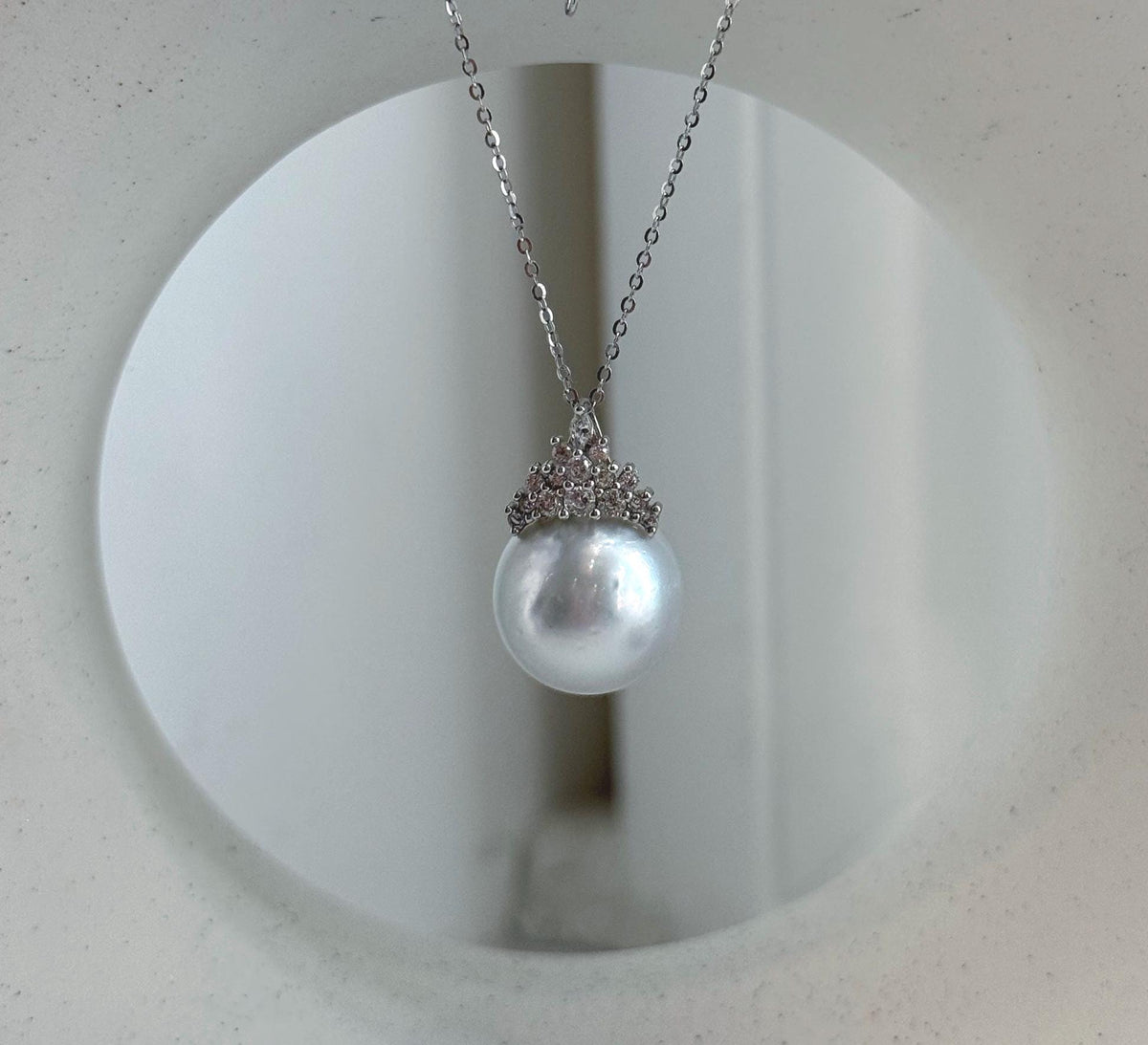 White South Sea pearl crown pendant on a delicate silver chain