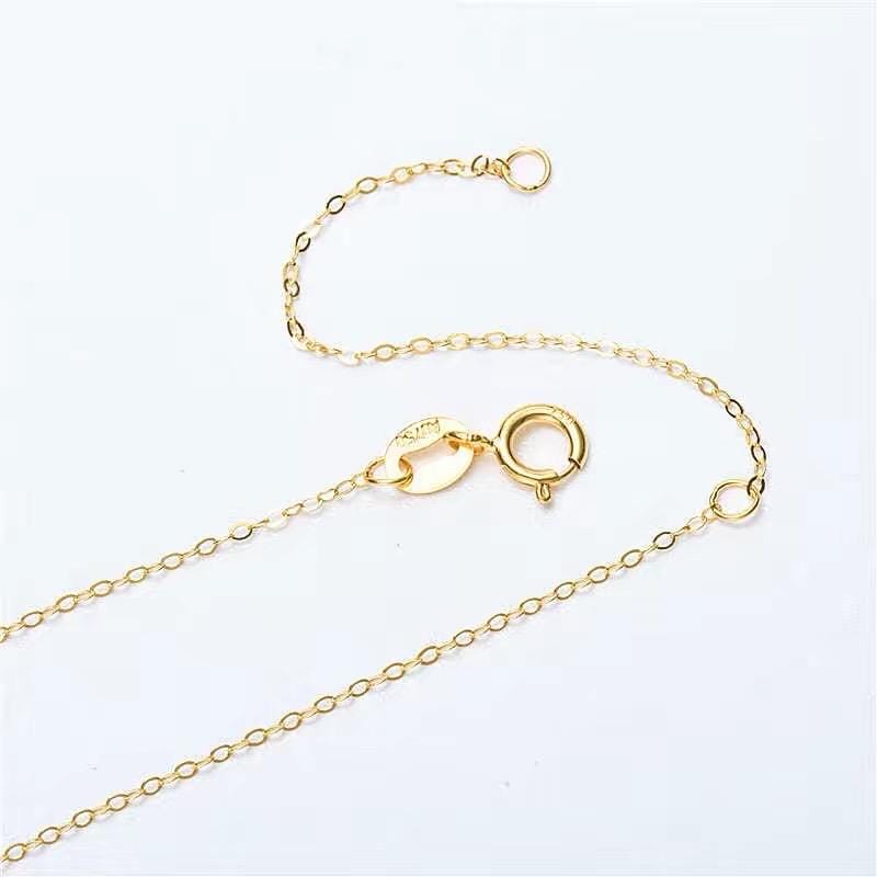 18K solid gold delicate necklace chain with fine links and a classic spring ring clasp.