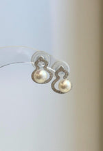 Detail of the genuine freshwater pearls and silver earring settings