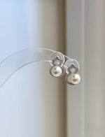 Elegant white pearl stud earrings with a gourd-inspired silhouette