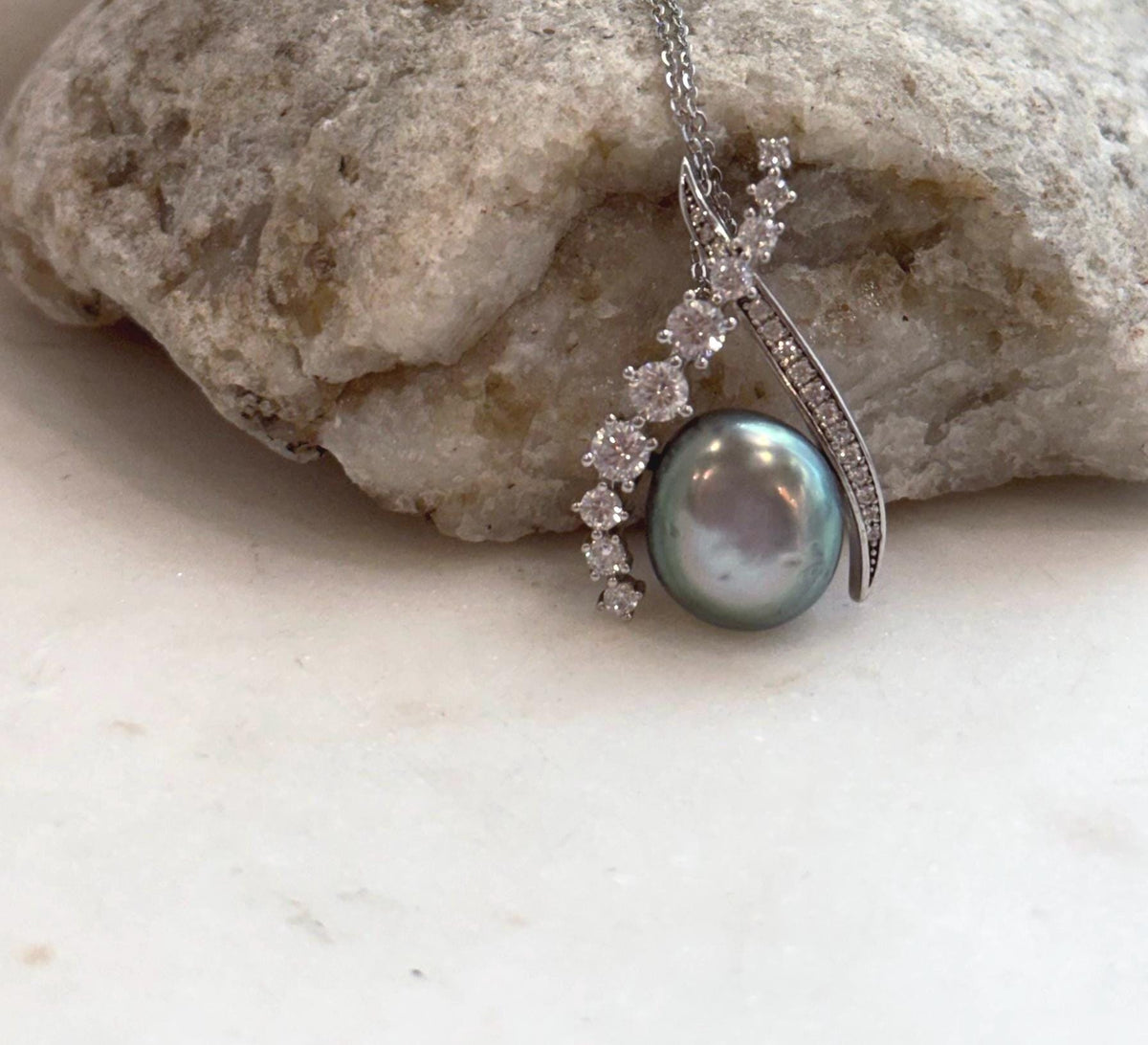 Unique Tahitian saltwater Keshi pearl pendant set with polished sterling silver.