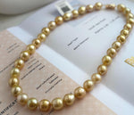 Golden pearl necklace shown to display the full strand