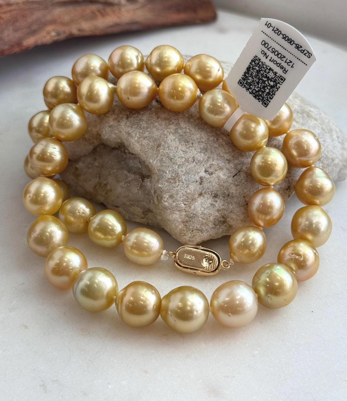 Golden South Sea pearls arranged together in a necklace