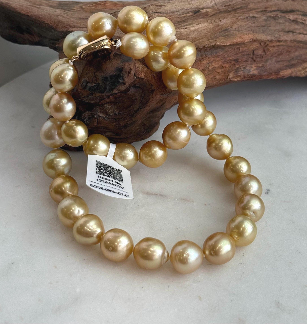 Close-up of the natural golden shades across the pearl necklace