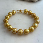 Golden Edison pearl bracelet with warm tones and a polished sterling silver clasp.