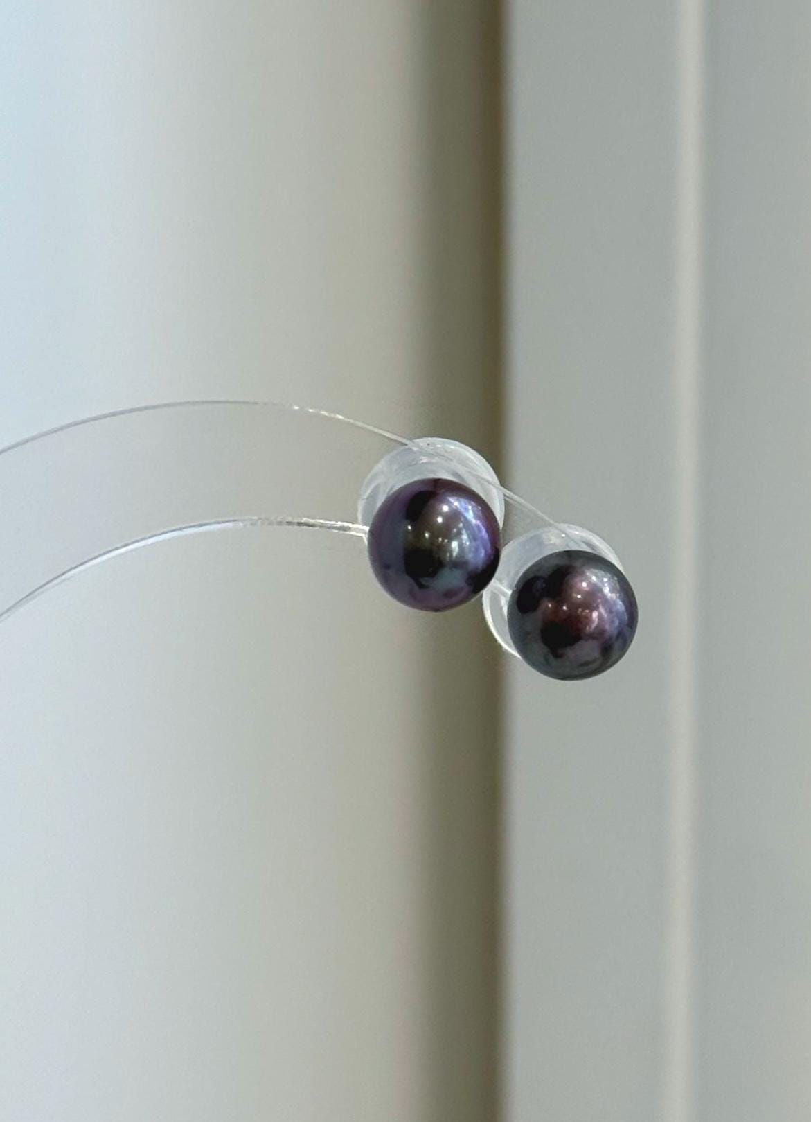 Plum purple freshwater pearl stud earrings with mirror luster and S925 sterling silver posts.