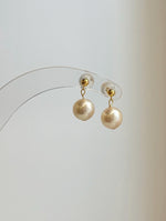 Minimalist ivory pearl drop earrings with yellow gold details