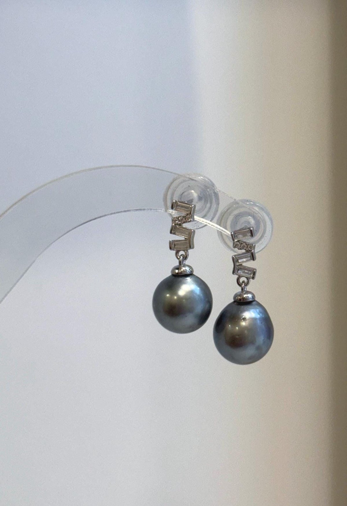 Genuine saltwater pearls with a cool platinum tone and reflective luster.