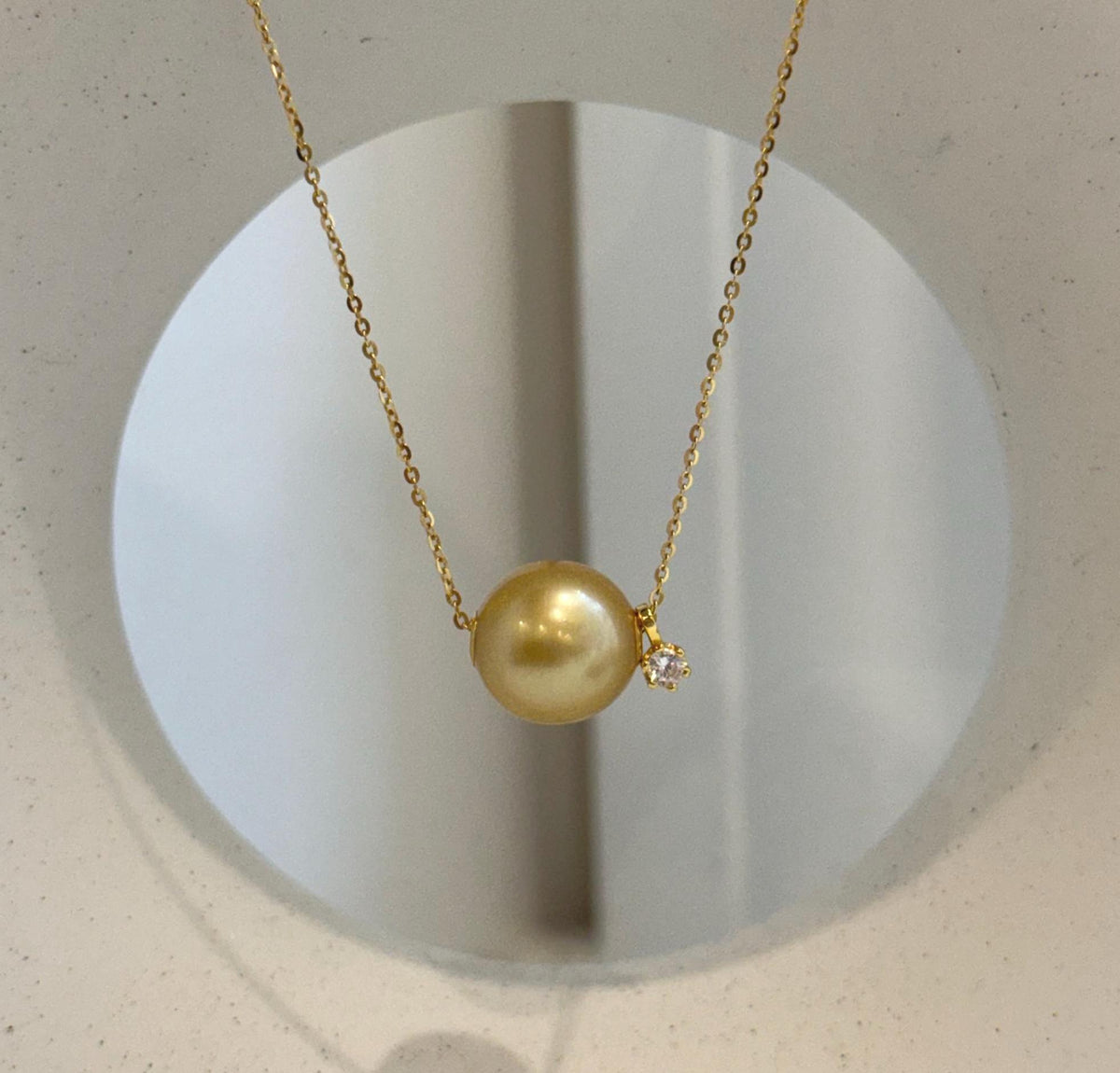 18K gold floating pearl necklace featuring a 13mm South Sea ocean pearl