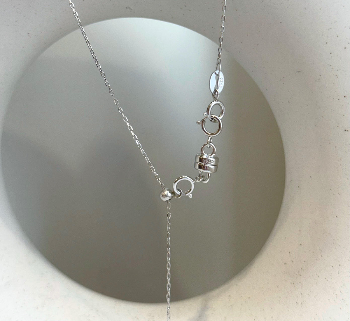 Modern floating pendant necklace with genuine Akoya and Edison pearls and polished gold details