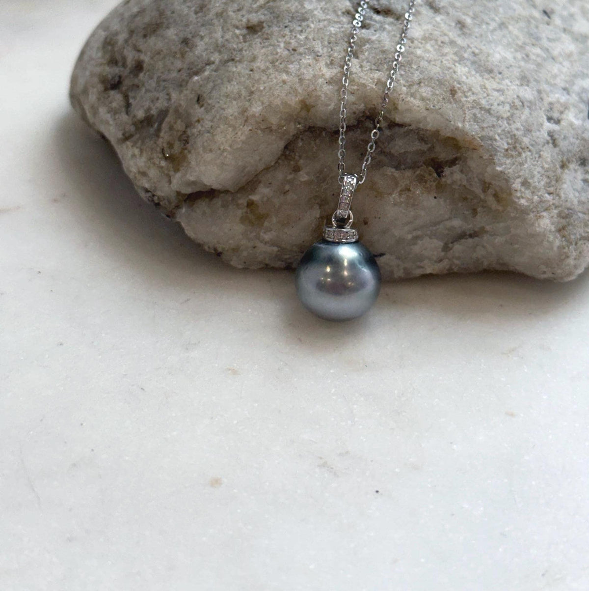 Platinum blue Tahitian pearl pendant necklace with a crystal-accented sterling silver setting