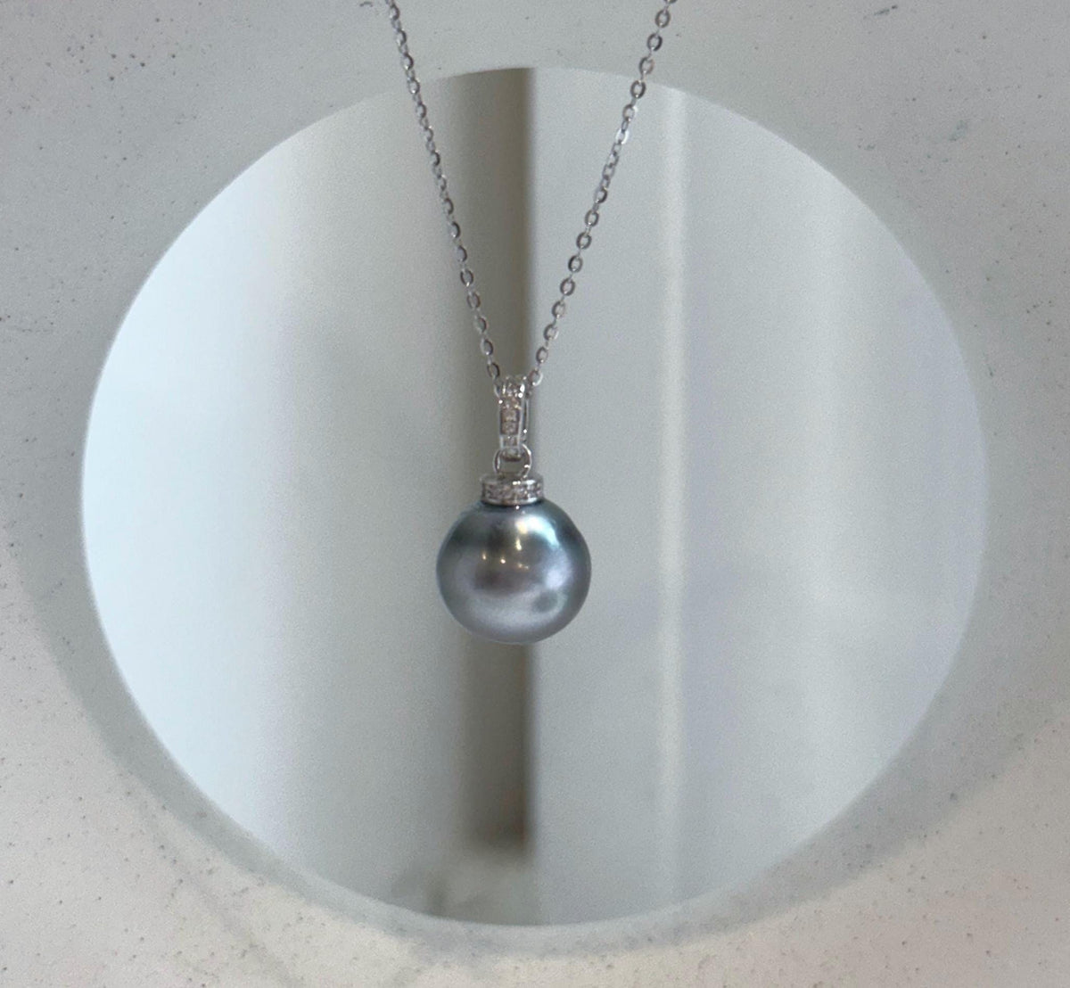 Single Tahitian pearl pendant necklace in a cool platinum blue tone