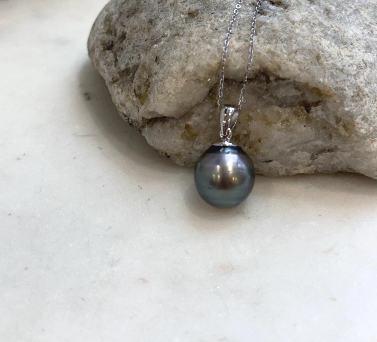 Hunter green pearl pendant with crystal accents.