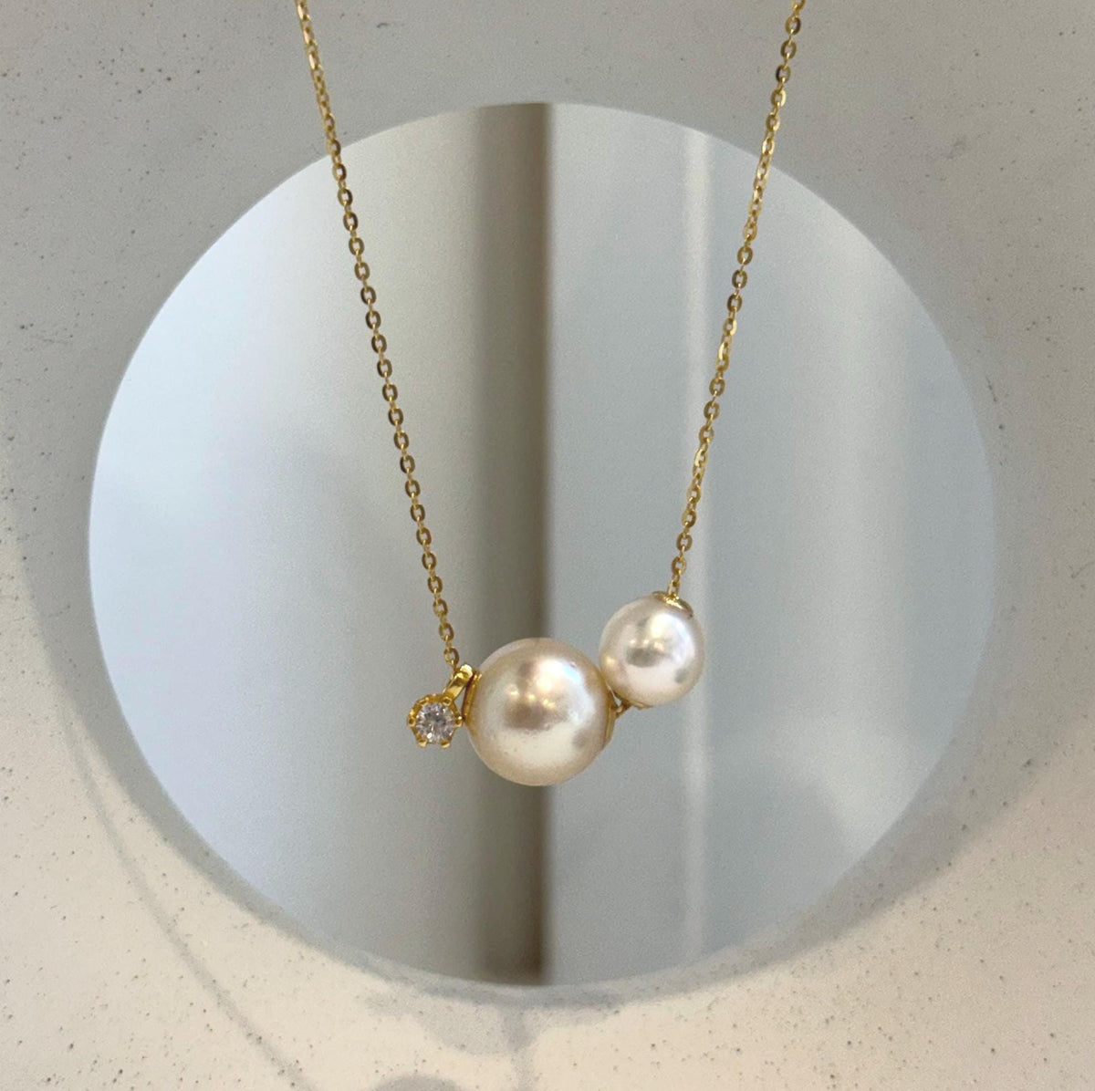 Minimalist three pearl necklace pendant with golden South Sea and Akoya pearls