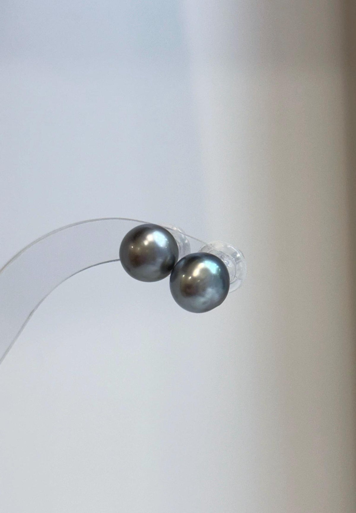 Genuine saltwater pearl studs with mirror luster.