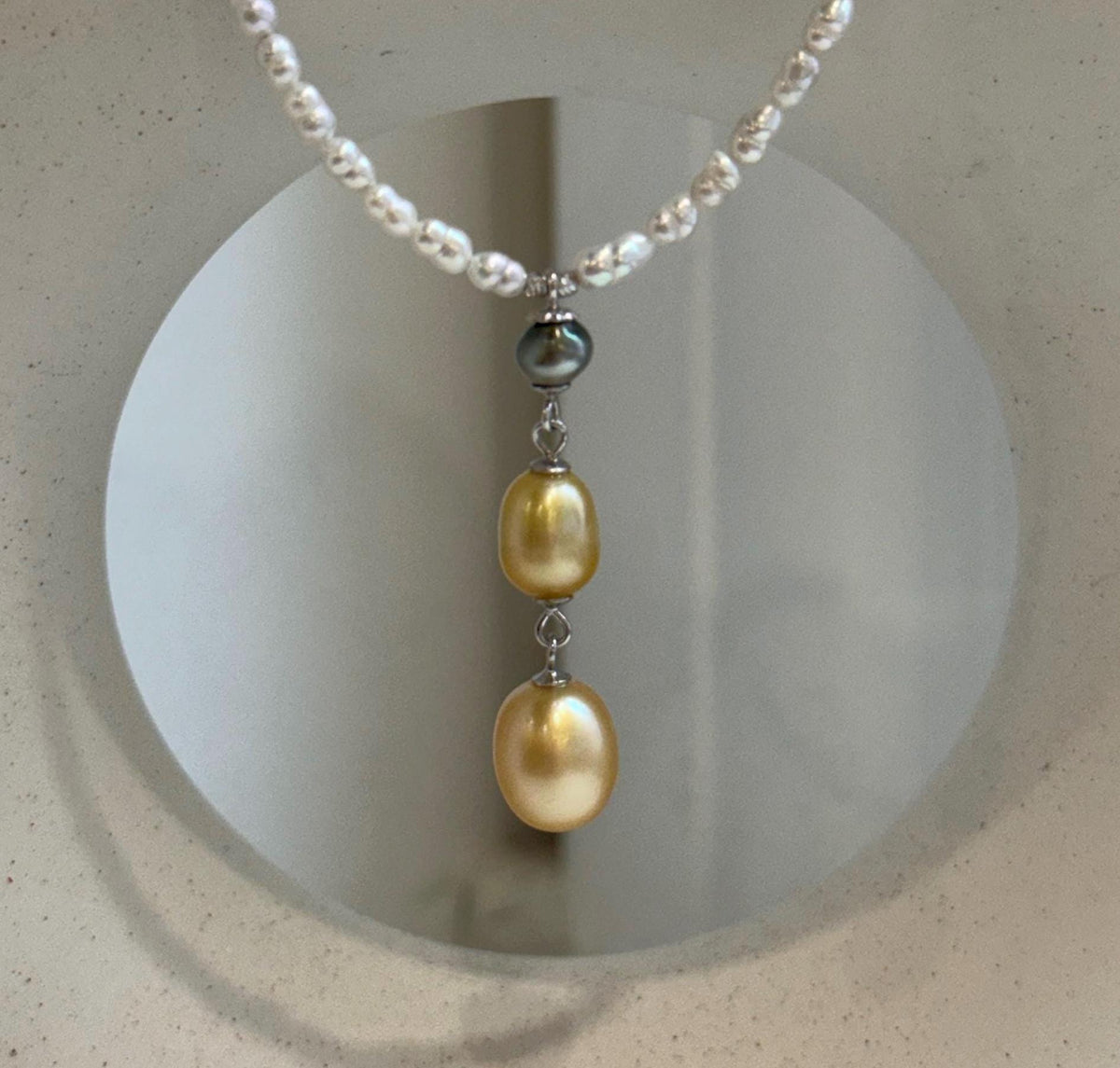 Mini white pearl strand necklace with Tahitian Keshi and golden pearl pendant