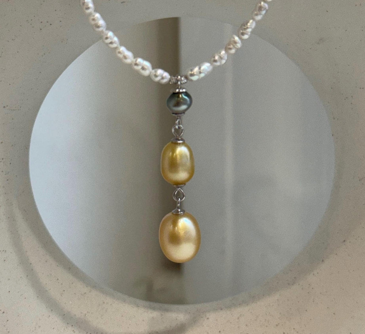 Tahitian Keshi pearl and golden South Sea pearl necklace with delicate white pearls