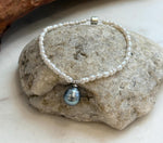 Handmade mini Keshi pearl strand necklace with Tahitian pearl centerpiece