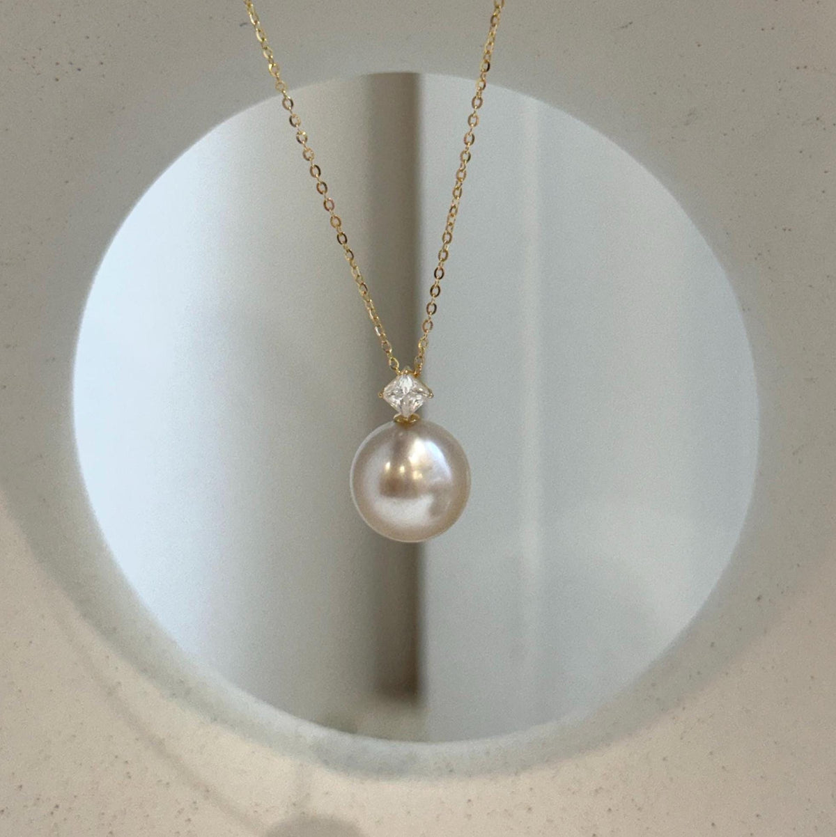 Genuine South Sea pearl pendant with rich champagne color and metallic mirror luster.
