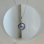 Platinum iridescent ocean round Mabe pearl pendant necklace with extreme mirror luster