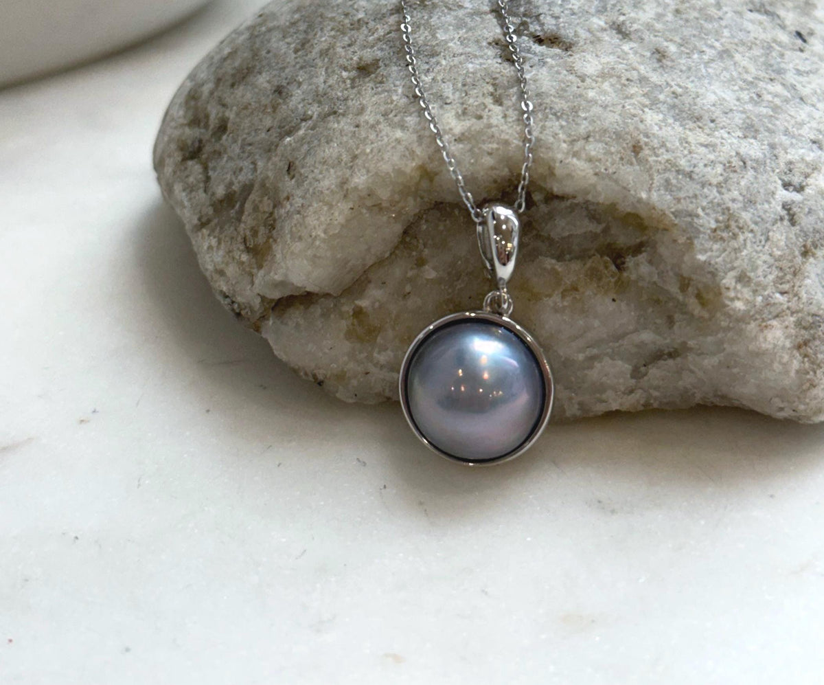 Genuine round Mabe pearl pendant featuring beautiful platinum iridescent tones