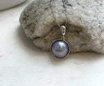 Genuine round Mabe pearl pendant featuring beautiful platinum iridescent tones